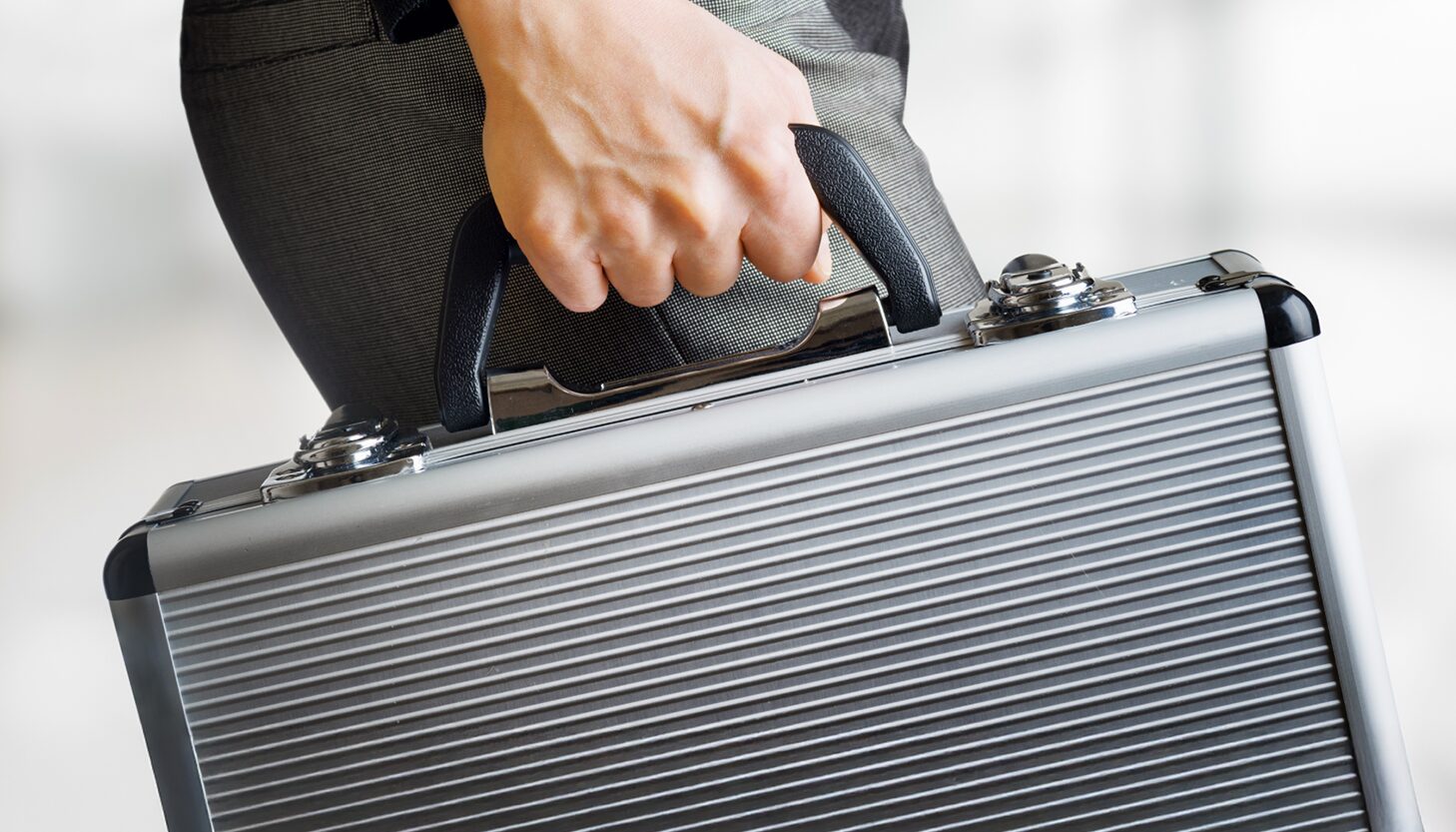 Dedicated On-Board Courier transporting urgent cargo by hand.